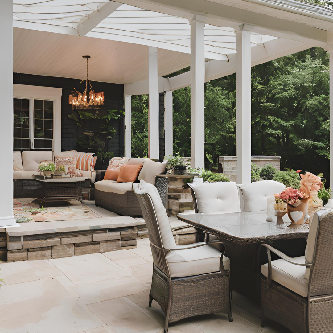 A patio with a table and chairs and a couch