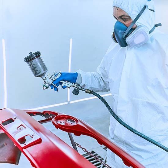 man painting car part — Paint Spraying Equipment & Booths in Fontana, CA