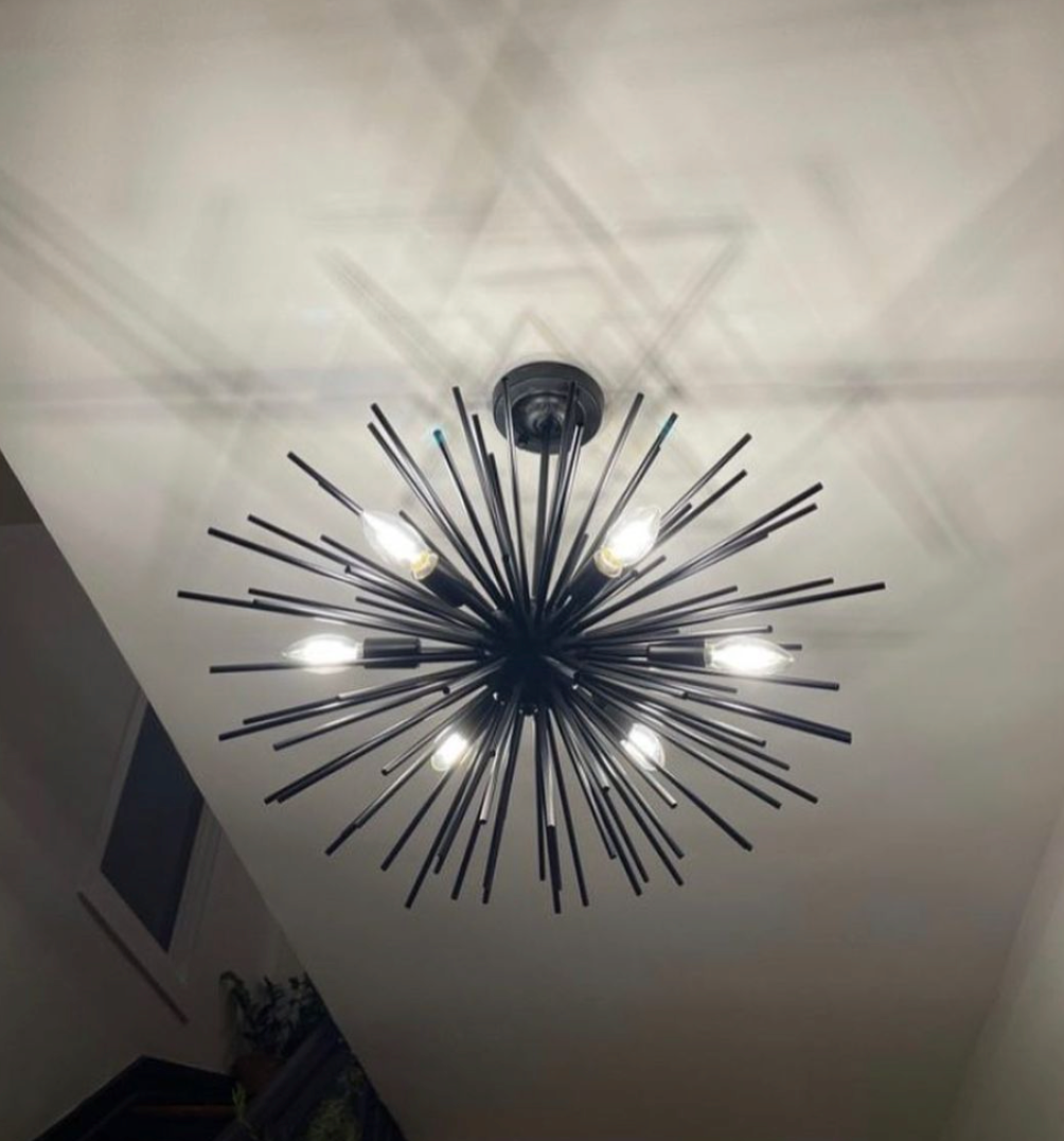 A chandelier that looks like a fireworks display is hanging from the ceiling