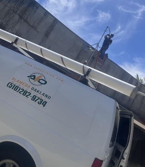 A white van with the number 510 282 9734 on it