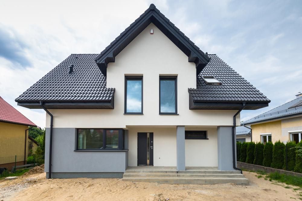 White House with A Black Roof and A Lot of Windows — Clearspan Builders In Queanbeyan East, NSW