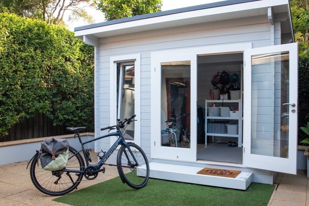 Bike Parked Outside a Shed With Open French Doors — Clearspan Builders In Michelago, NSW