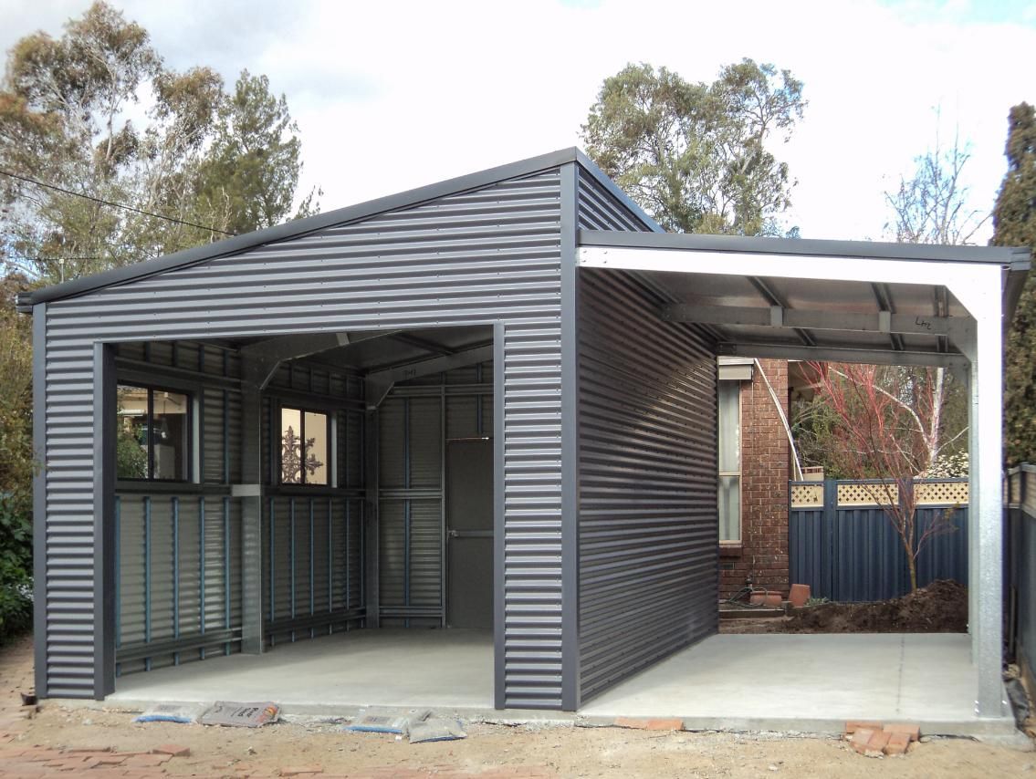 A Garage with A Carport Attached to It Is Being Built in The Backyard of A House — Clearspan Builders In Queanbeyan East, NSW