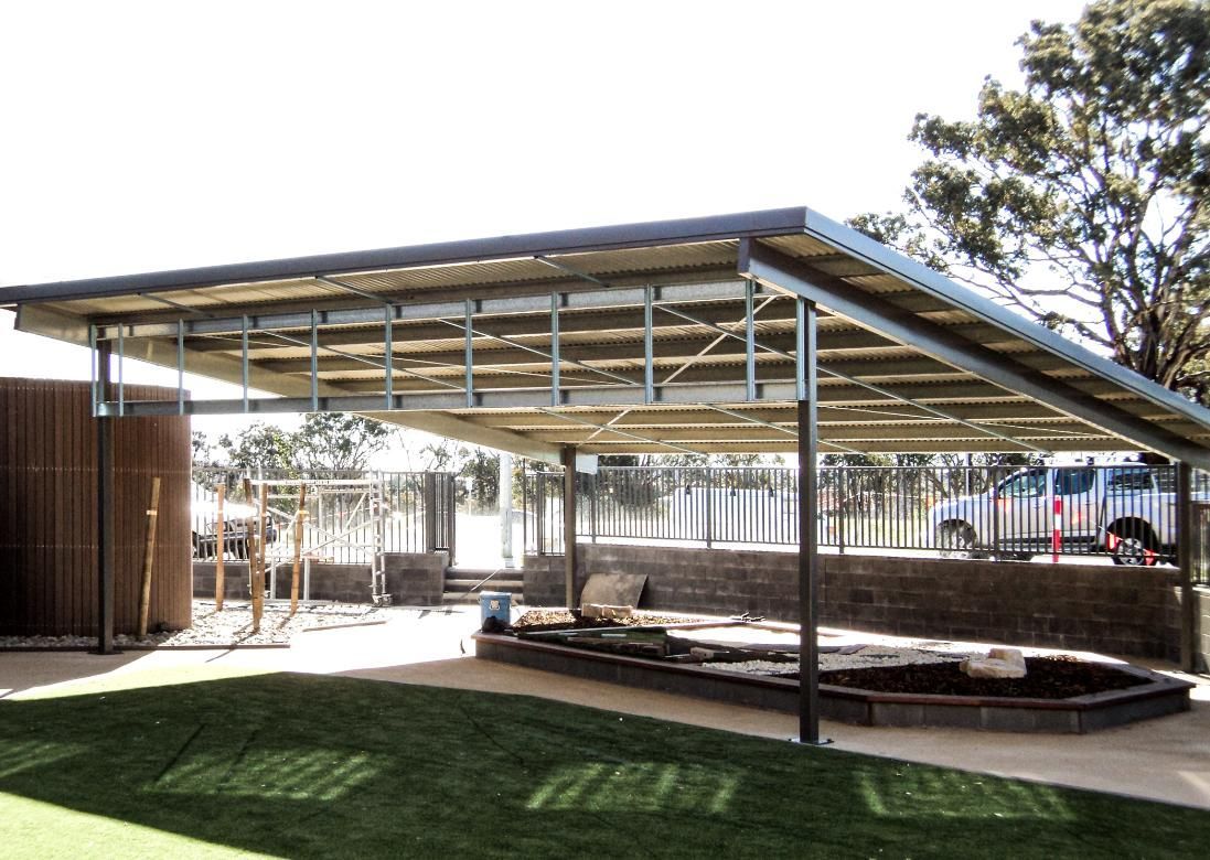 A Covered Area with A Playground in The Background — Clearspan Builders In Queanbeyan East, NSW