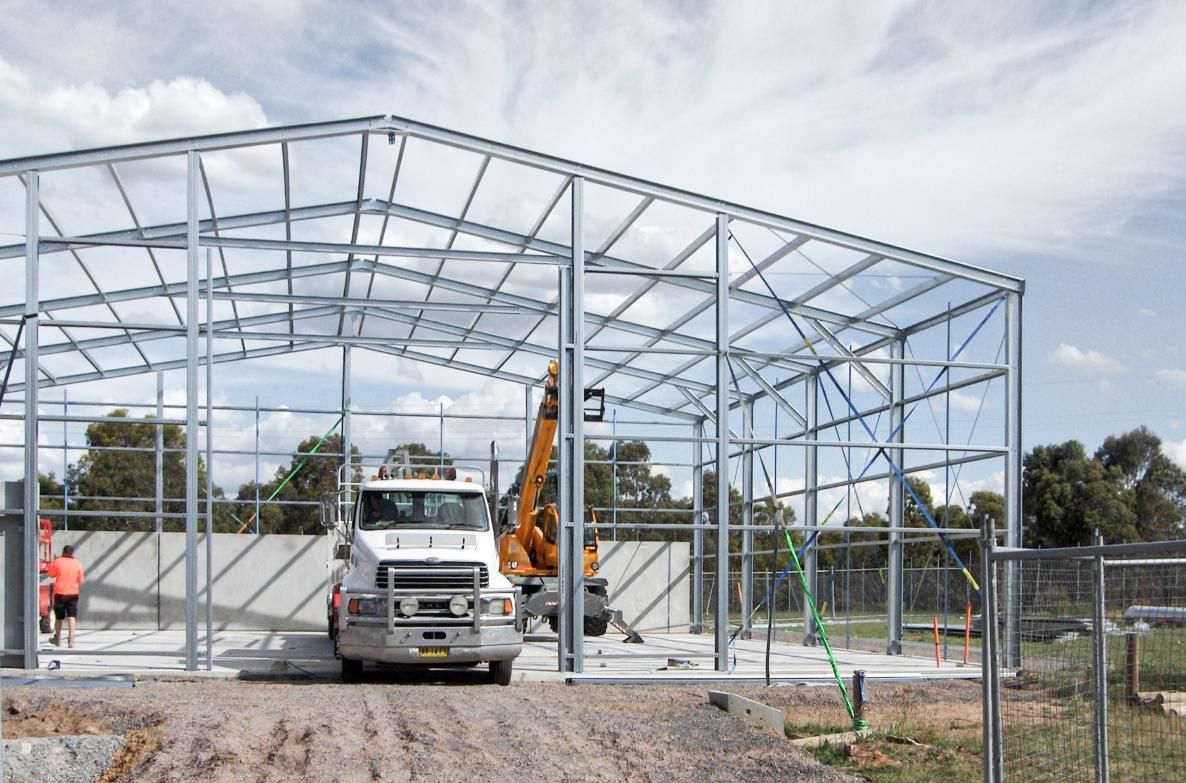 A Truck Is Parked in Front of A Building Under Construction — Clearspan Builders In Queanbeyan East, NSW