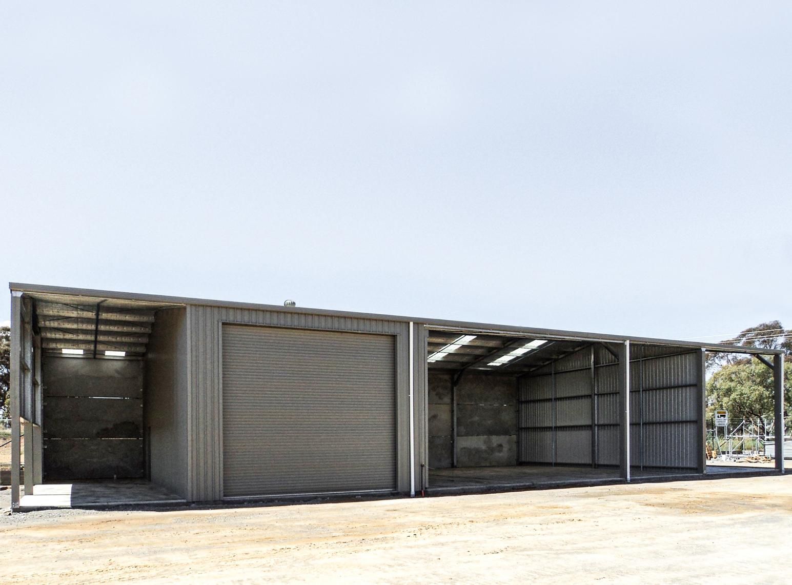 A Large Metal Building with A Lot of Doors — Clearspan Builders In Queanbeyan East, NSW