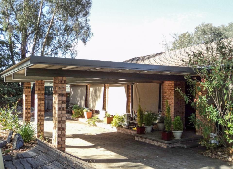 A House with A Carport in Front of It — Clearspan Builders In Queanbeyan East, NSW