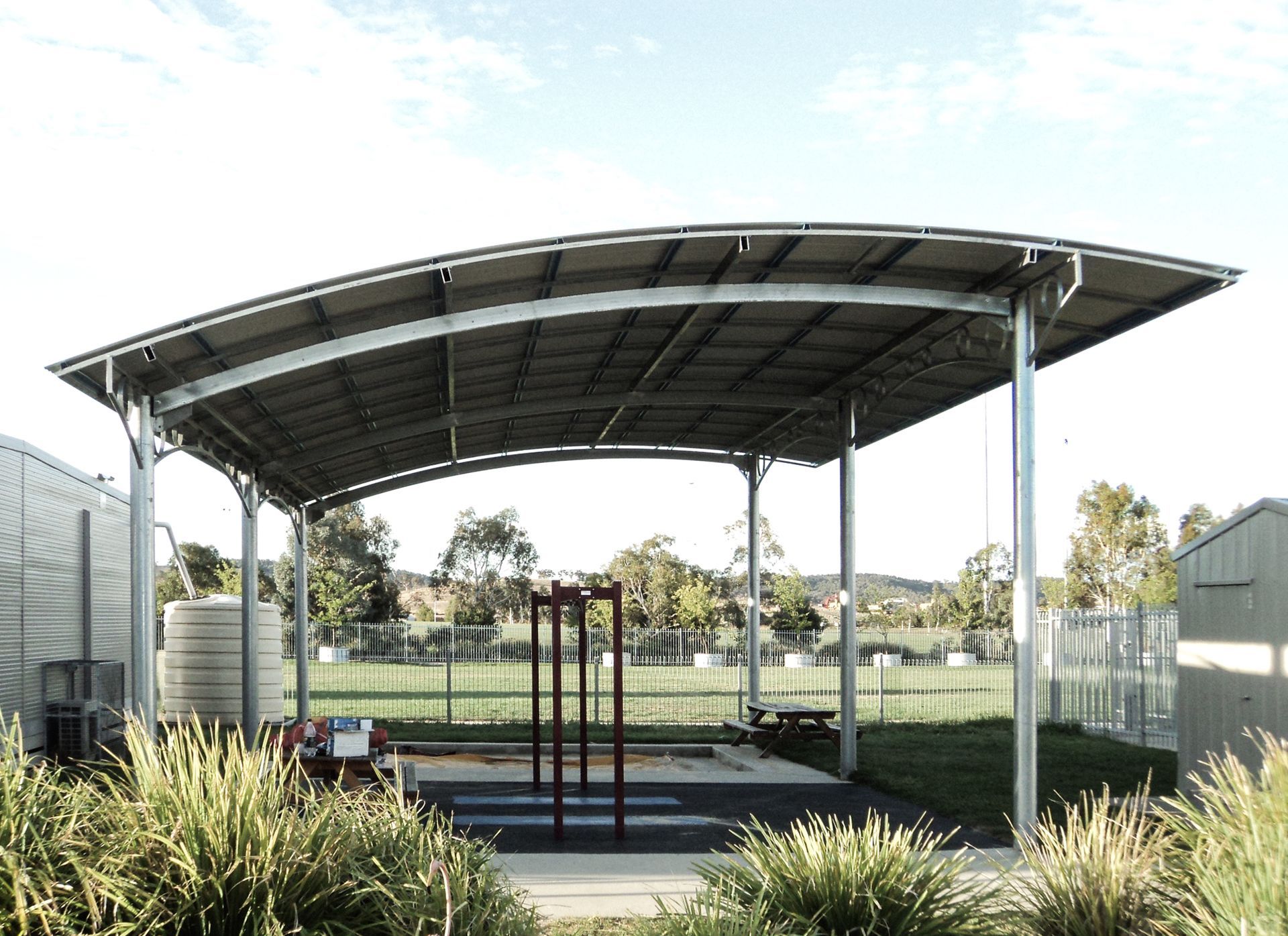 A Park With Shelter And Plants Surrounding It— Clearspan Builders In Queanbeyan East, NSW