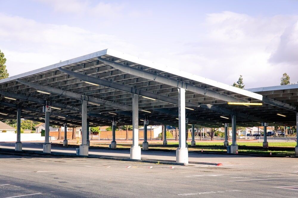 Solar Panel Carport Structure in a Parking Lot — Clearspan Builders In Bungendore, NSW