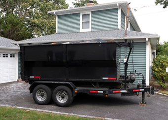 A junk removal service team in Rowlett, Texas getting ready to complete a residential junk removal job