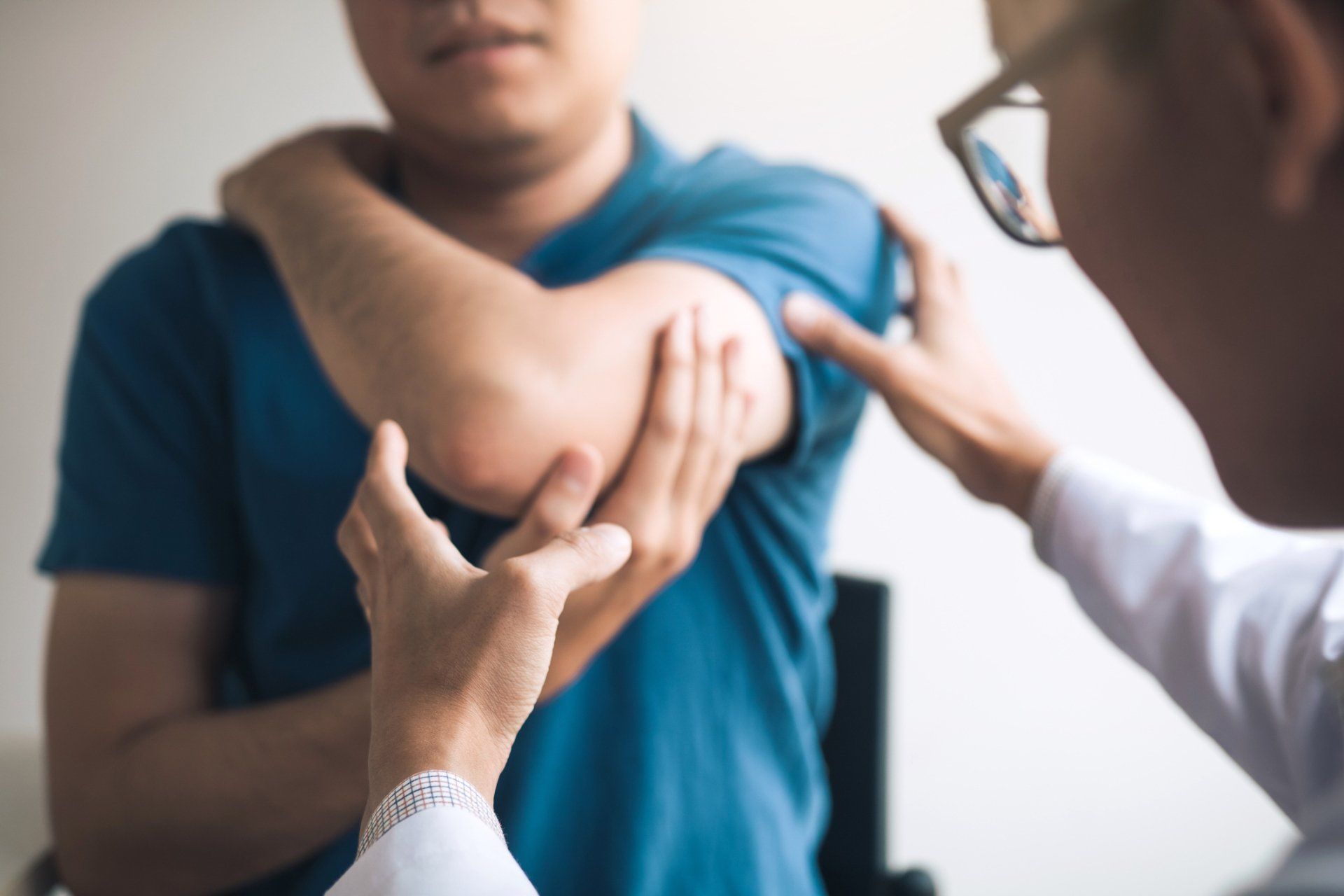 Therapist Checking Patient's Elbow — Wetherill Park, NSW — JQ Physiotherapy & Sports Rehabilitation