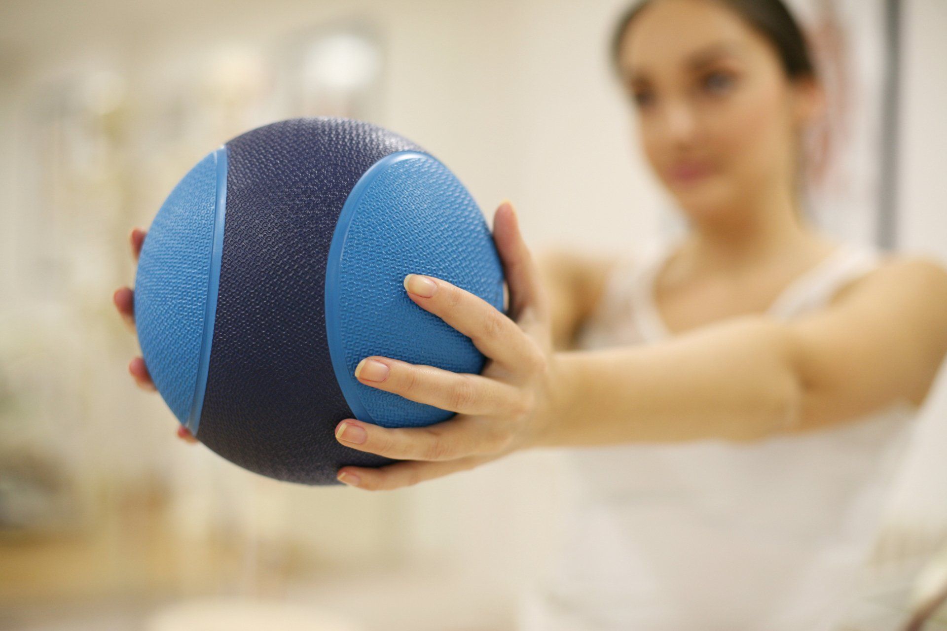 Woman Holding a Ball — Wetherill Park, NSW — JQ Physiotherapy & Sports Rehabilitation