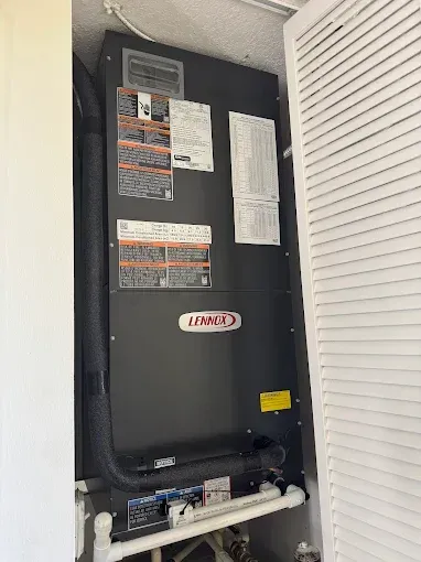 A lennox air conditioner is sitting on top of a shelf in a room.