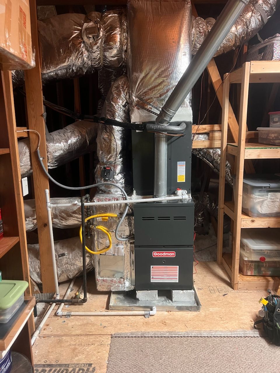 There is a furnace in the attic of a house.