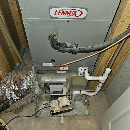 A lennox air conditioner is installed in a basement