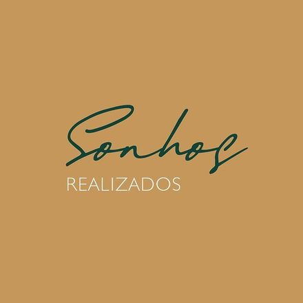 A logo for sonhos realizados on a brown background