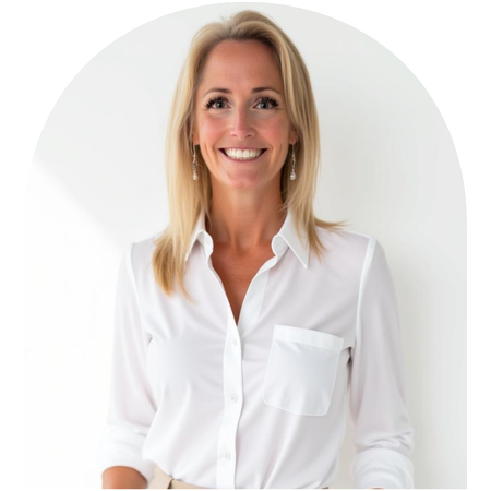 A woman in a brown jacket and white shirt is smiling in front of a river. Terri Ward