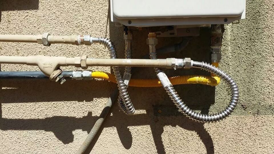 Gas Line Repair in Orange, CA – indoor gas line setup connected to water heater with control valve and piping