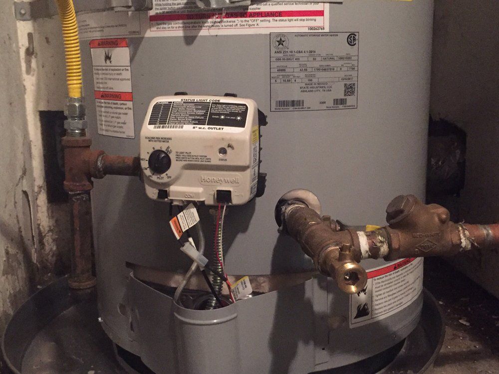 Gas Line Repair in Orange, CA 2 – outdoor gas line connections and flexible piping attached to home system