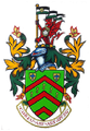 A coat of arms with a dragon on top of it