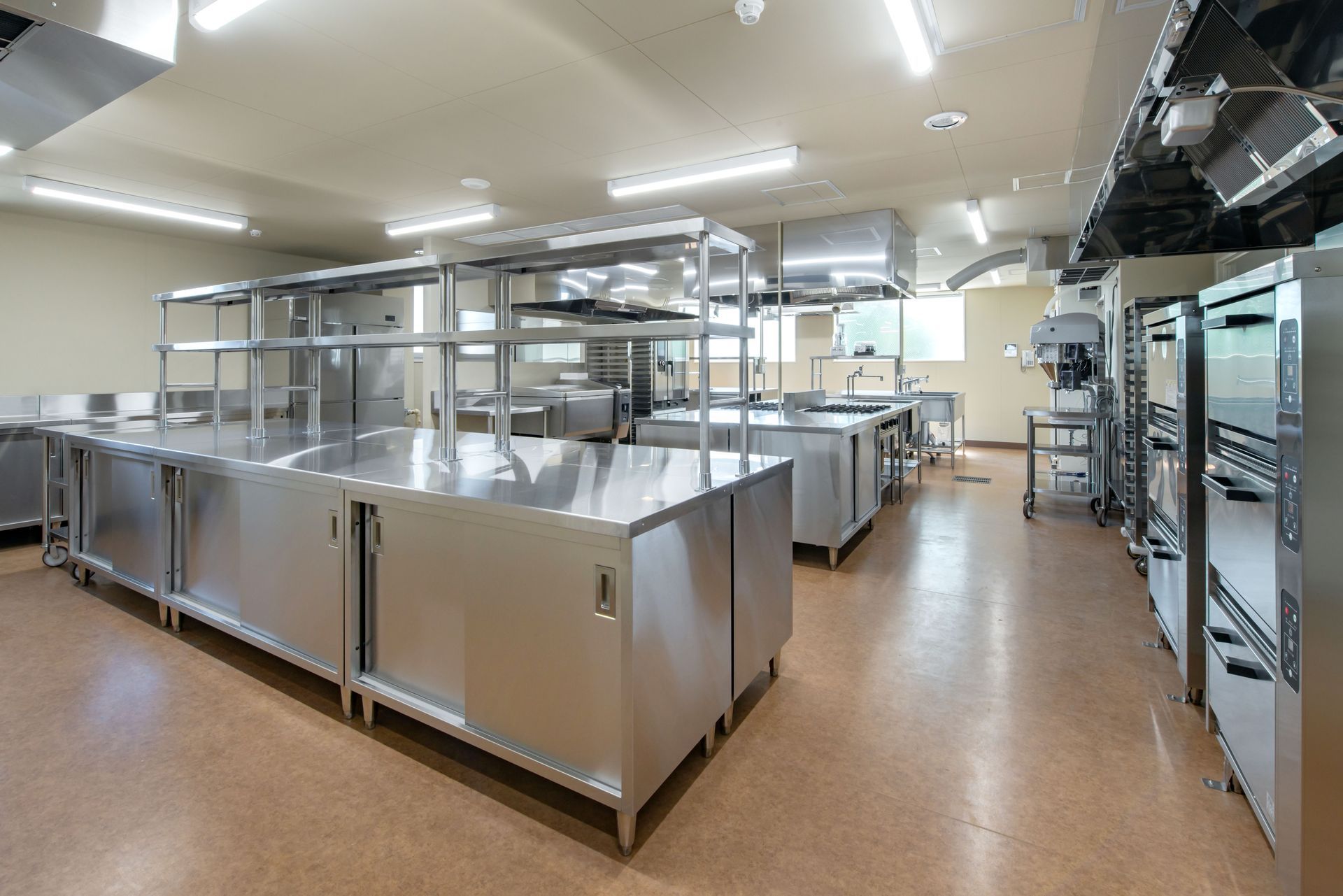 Large, Industrial Kitchen With Stainless Steel Counters — Central Coast Commercial Kitchen Cleaning in Tuggerah, NSW