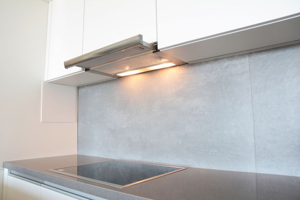 Kitchen With Gray Countertop, Cooktop — Central Coast Commercial Kitchen Cleaning in Tuggerah, NSW