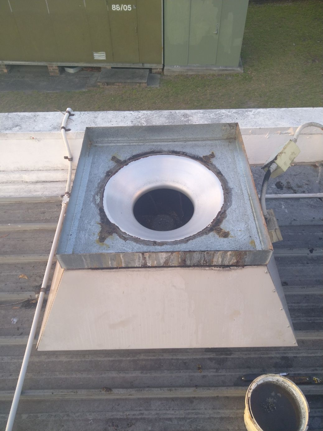 Metal Roof Vent With a Shiny, Circular Interior and Square Frame — Central Coast Commercial Kitchen Cleaning in Swansea, NSW
