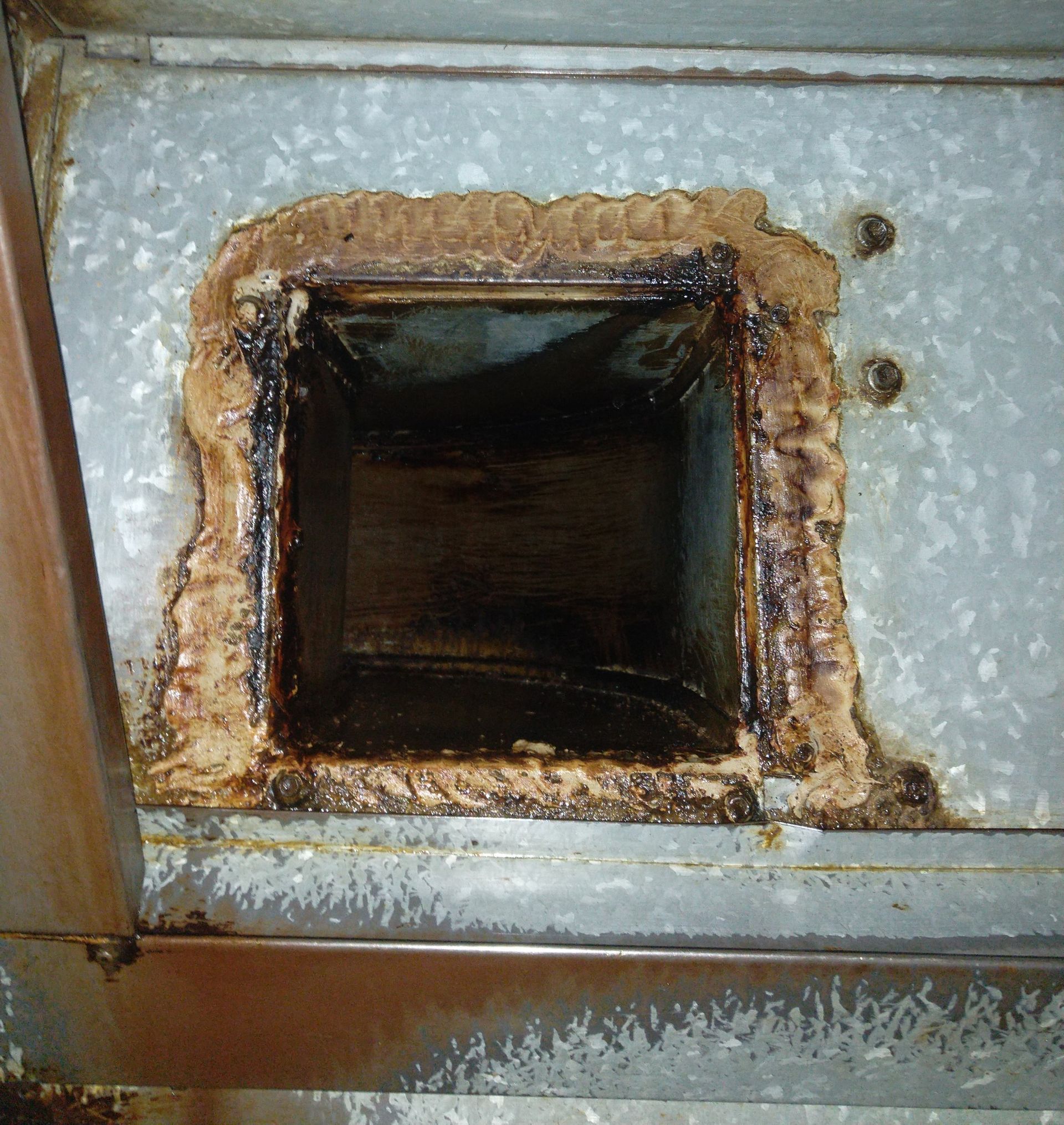 Open, Dirty Air Duct With Dark Interior — Central Coast Commercial Kitchen Cleaning in Newcastle, NSW