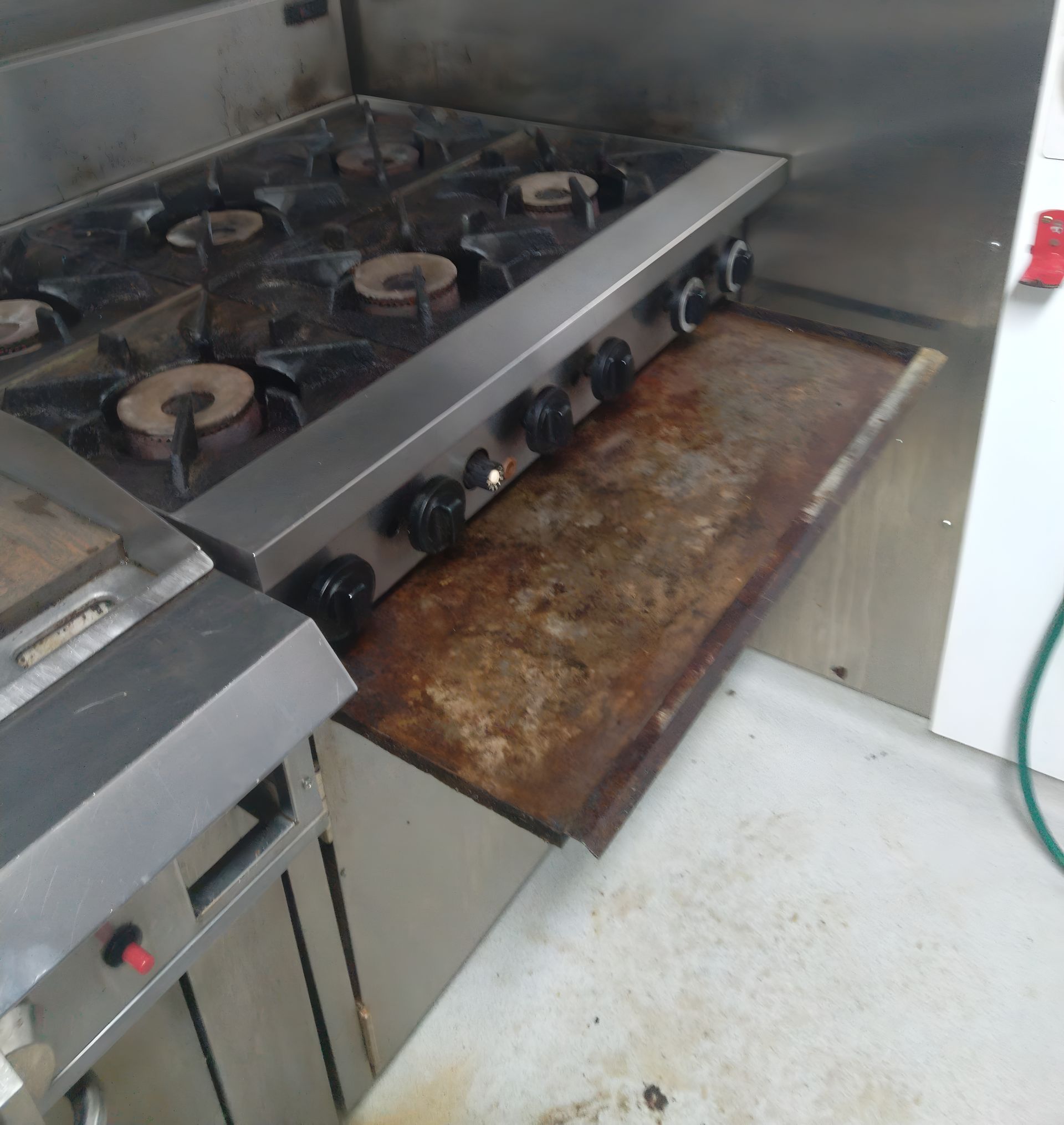 Commercial Kitchen Stove With Six Burners and a Griddle — Central Coast Commercial Kitchen Cleaning in Newcastle, NSW