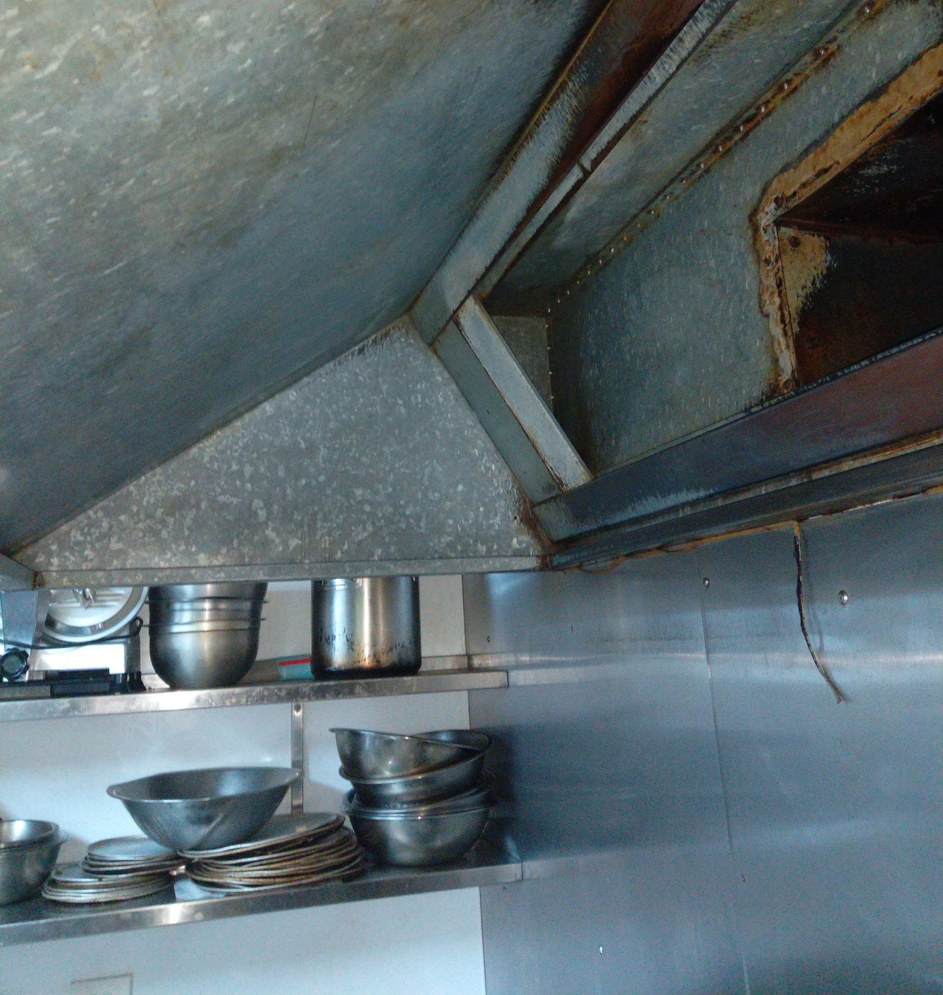 Commercial Kitchen Exhaust Hood Above a Stainless — Central Coast Commercial Kitchen Cleaning in Belmont, NSW