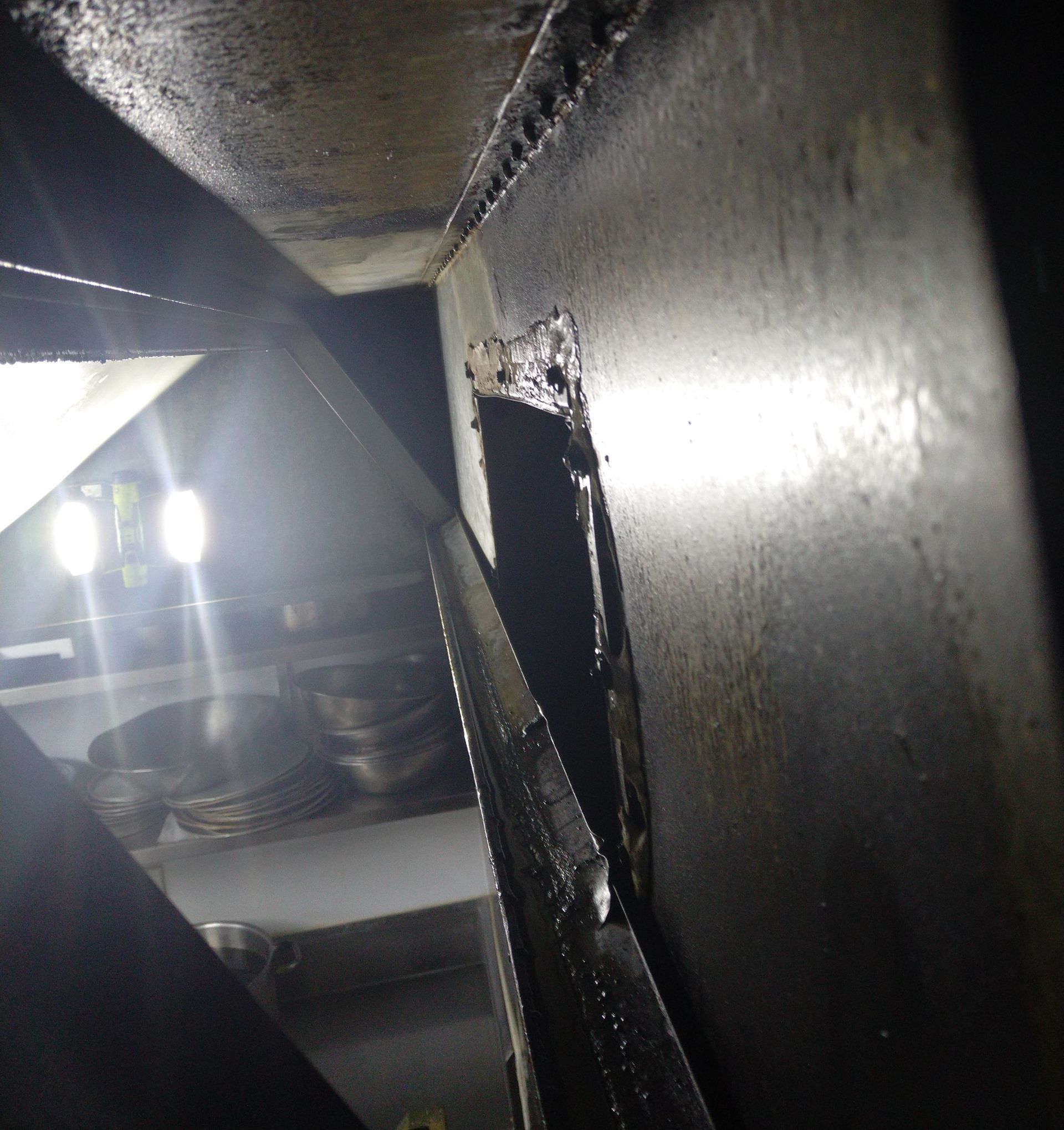 Dark Metal Interior With a Rectangular Opening — Central Coast Commercial Kitchen Cleaning in Woy Woy, NSW