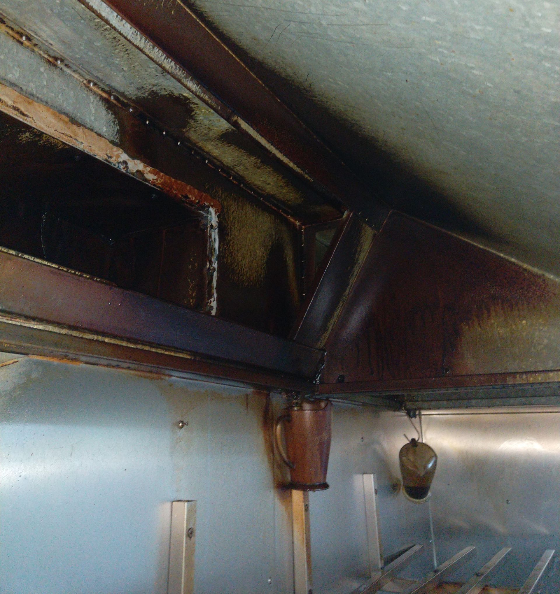 Inside of a Kitchen Filter, Coated in Dark Brown Grease — Central Coast Commercial Kitchen Cleaning in Newcastle, NSW