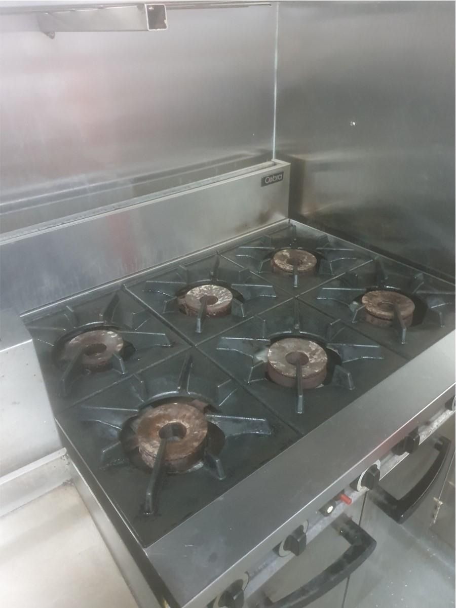 Commercial Stainless Steel Gas Stove With Six Burners — Central Coast Commercial Kitchen Cleaning in Terrigal, NSW