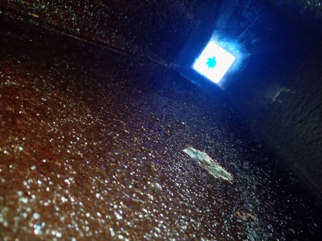 Dark, Textured Surface With a Small, Glowing Blue Square — Central Coast Commercial Kitchen Cleaning in Tuggerah, NSW