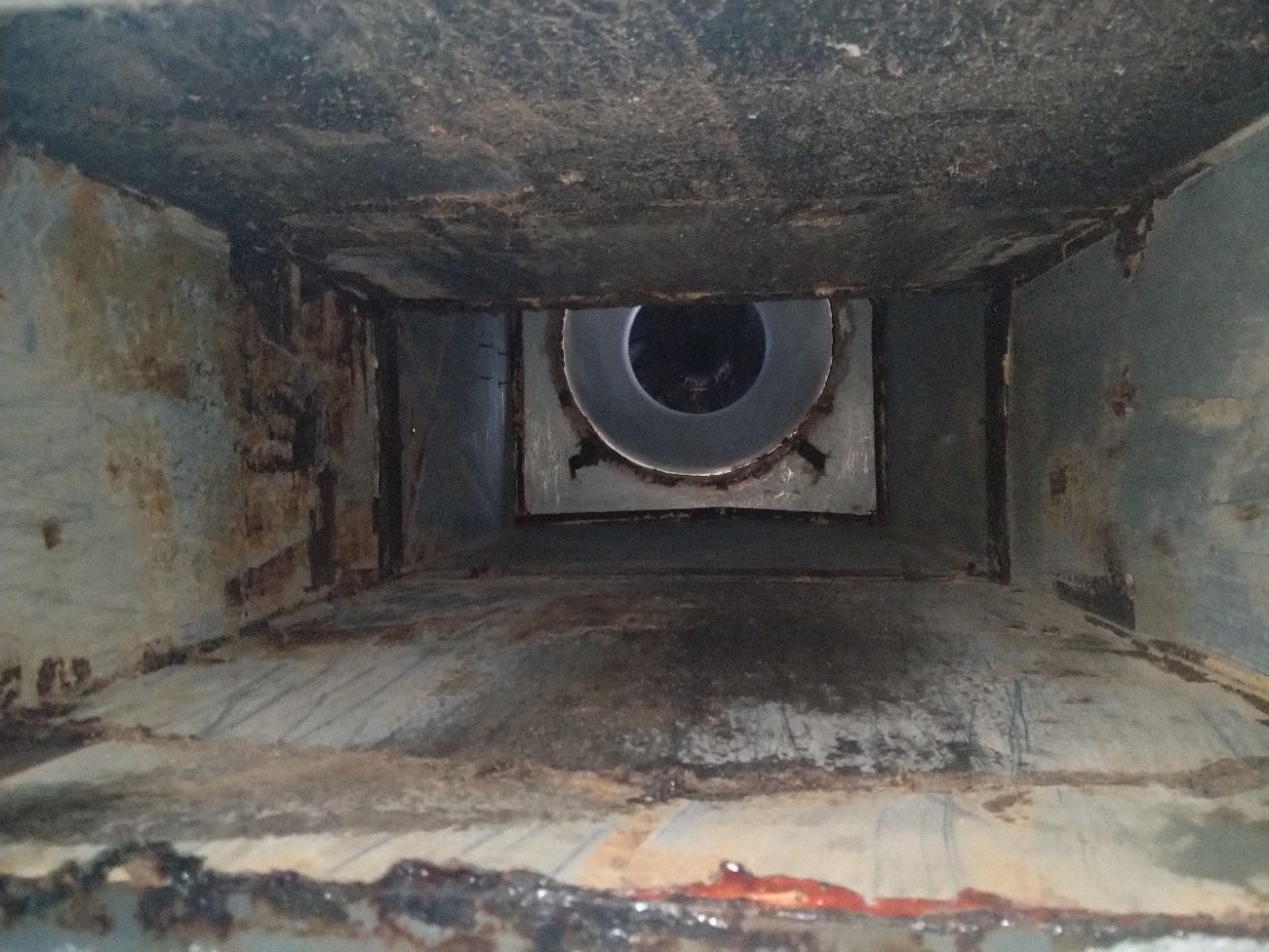 Inside of a Rectangular, Rusty Duct — Central Coast Commercial Kitchen Cleaning in Tuggerah, NSW