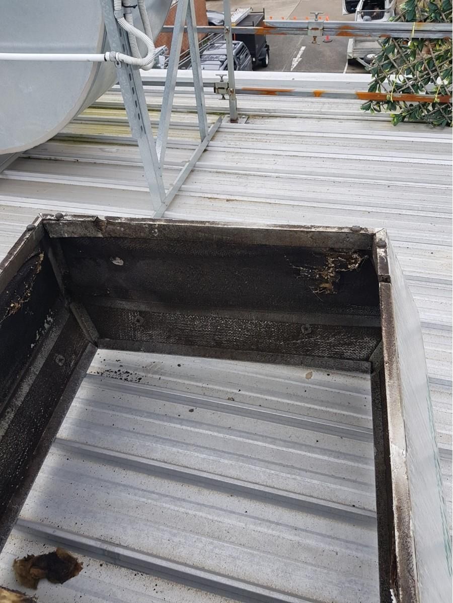 Kitchen Canopy Being Clean — Central Coast Commercial Kitchen Cleaning in Tuggerah, NSW