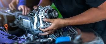 Mechanic replacing alternator in Fort Walton Beach auto repair shop