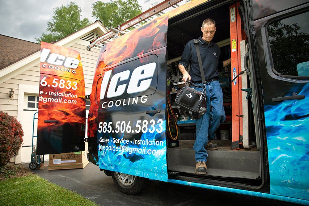 A man is getting out of a Dolce HVAC van.