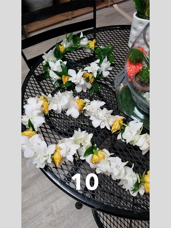 A table with flowers and the number 10 on it