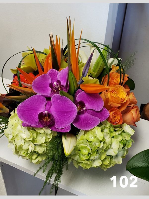 A bouquet of flowers with the number 102 on the bottom