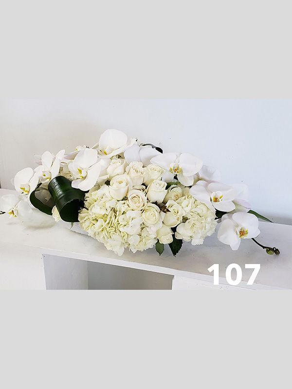 A bunch of white flowers are sitting on a table.