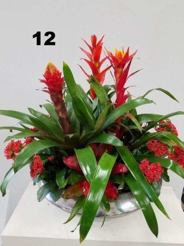 A bowl of flowers with the number 12 on the bottom