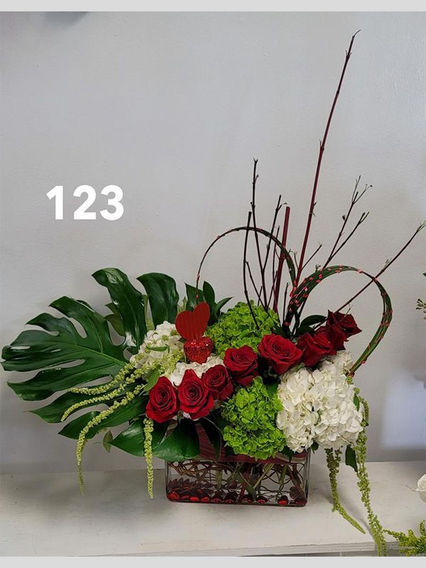 A vase of flowers with the number 123 on the bottom