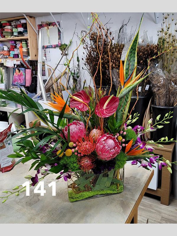 A vase filled with flowers is sitting on a table.