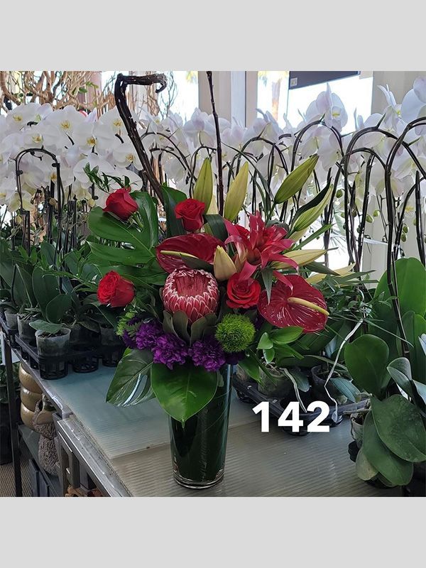 A vase filled with flowers is sitting on a table.