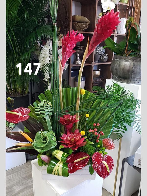 A vase of flowers with the number 147 on it