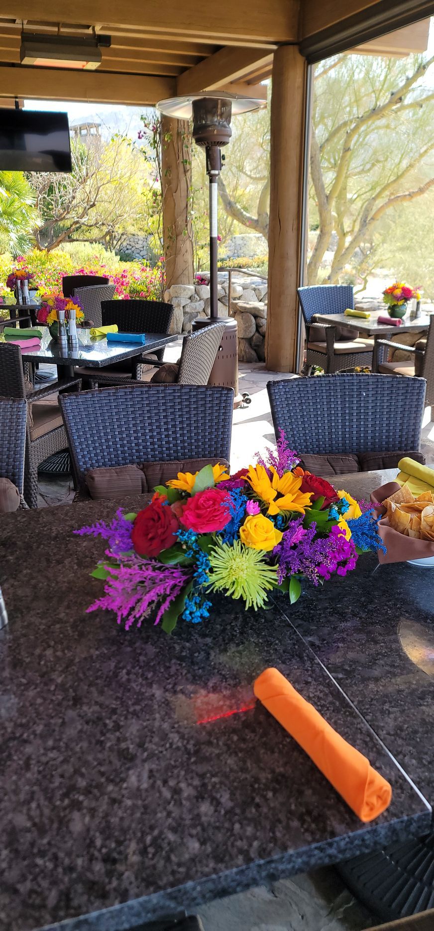A table with a vase of flowers on it.