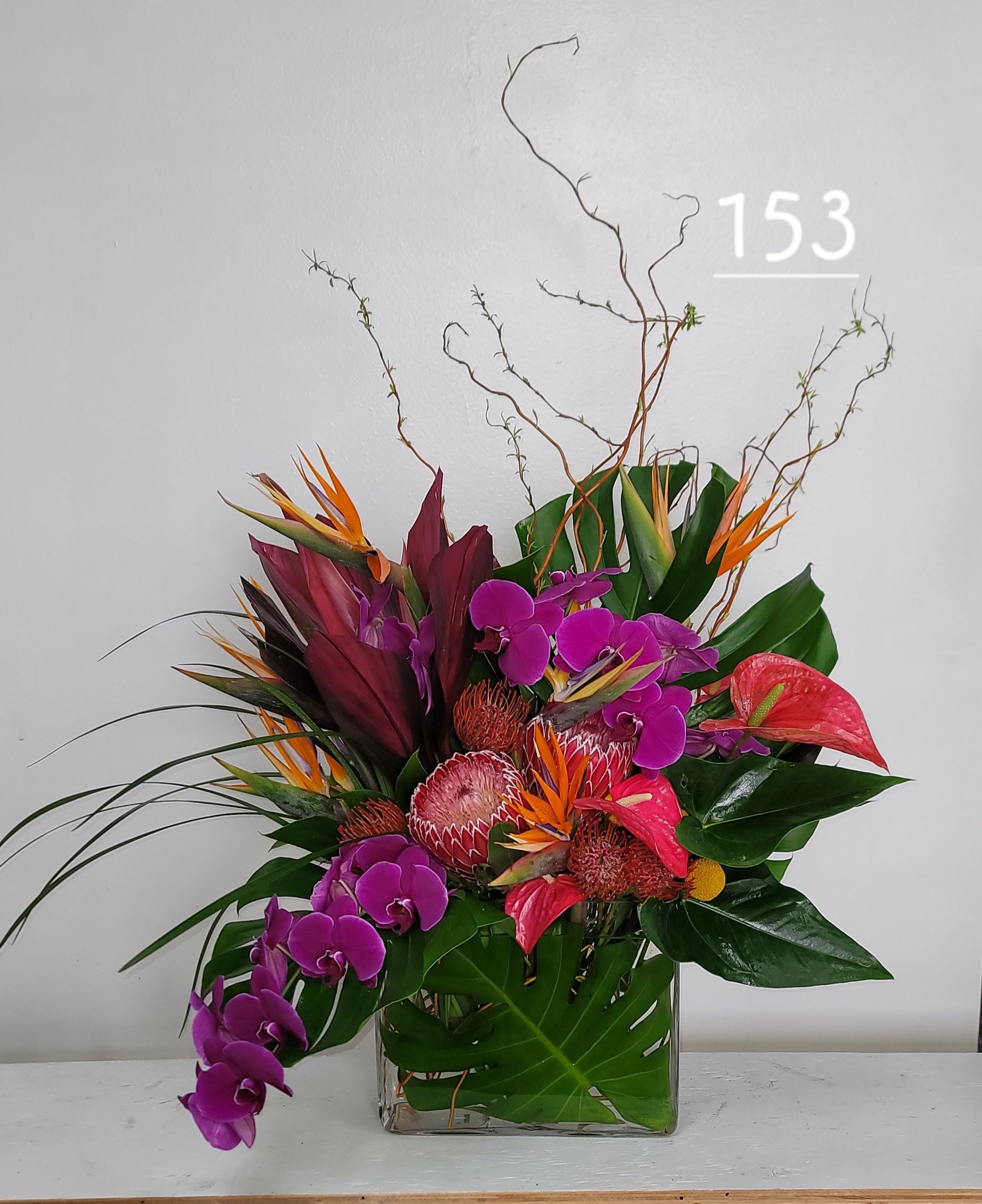 A vase of flowers with the number 153 on it