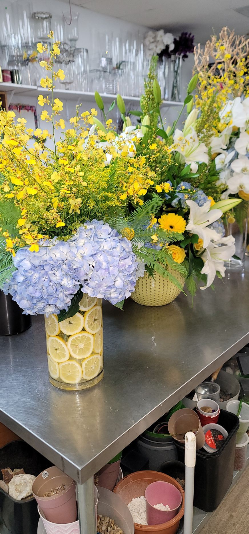 There are many different types of flowers on the table.
