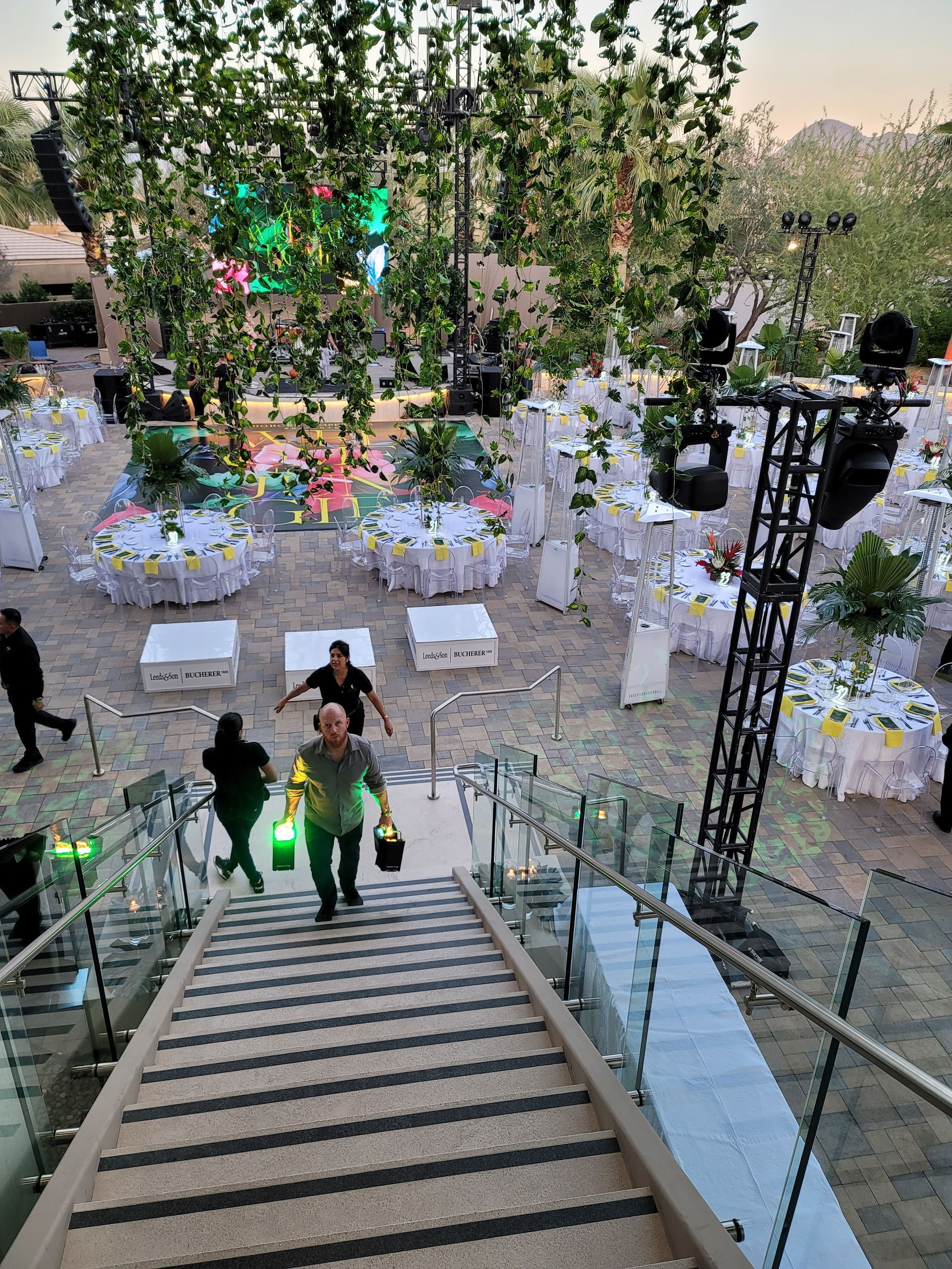 A group of people are walking up a set of stairs.